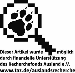 Eine Lupe mit einer Tatze - Logo des taz Recherchefonds Ausland