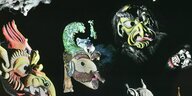 Hinterleuchtete Collage zeitgenössischer Perchtenmasken
