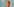 ein gemaltes Bild zeigt Günther Oettinger hinter einer Scheibe mit EInschussloch