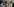 Trinkende, geschminkte Frauen und Männer