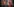 Julia Klöckner und Angela Merkel stehen lächelnd vor einem Plakat mit lächelnden Gesichtern.