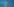 Ein laufendes Windrad steht vor einem blaunen Himmel