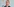 De Maizière, mit Anzug, Krawatte und Brille, spricht ins Mikrophon
