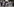 Eine kleinere Gruppe demonstriert und hält Schwarz-weiß-Fotos von Personen hoch
