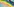 Ein auf eine Hauswand gemalter Regenbogen, der Verputz der Wand ist teilweise abgeblättert