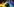 Eine Person mit türkisfarbenen Haar steht vor einer großen Regenbogenfahne