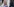 Gina-Lisa Lohfink, eine junge Frau mit langen blonden Haaren trägt ein rosa-farbenes Oberteil mit weitem Ausschnitt und posiert für Kameras