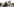 Auf einem Wandgemälde an der Roten Flora in Hamburg sind vier Köpfe schwarz übermalt.