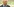 Beckenbauer guckt ernst, hinter im ist unscharf glitzerner Regen zu erkennen