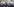 Im Vordergrund Polizei, im Hintergrund eine Fan-Demo und durch die Luft fliegende Tickets