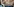 ein Frau hat ein Maßband um ihren Bauch gespannt