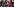Eine Frau steht vor Pressefotografen