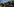 Das gelbe Logo der Pizzeria "Comet Ping Pong". Um den Schriftzug "Comet" befinden sich Steren und Monde.
