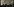 Menschen stehen bei schwacher Beleuchtung beieinander. Auf einem Banner steht: Become Ungovernable
