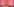 Eine pink gestrichene Gefängniszelle. Auf dem Boden liegt eine Matraze