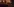 Szene aus einem Computerspiel, eine Frau schaut einen Brief an