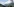 Eine österreichische Landschaft mit Bergen, blauem Himmel und Wolken