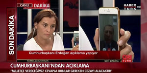 TV-Bild von Hande Fırat und Handy