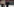Eine demonstrierende Person mit einem Plakat, auf dem „Erdogan - und das G steht für Grunrechte“ steht