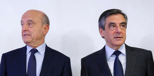Alain Juppé schaut nach links, Francois Fillon nach rechts