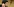 ein Mann, im Hintergrund ein Kruzifix