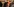 zwei Männer in Talaren umarmen sich, es sind der Ratsvorsitzende der Evangelischen Kirche Bedford-Strohm und der Vorsitzende der Bischofskonferenz Marx