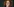 Anetta Kahane hat ihr Kinn auf ihre verschränkten Hände gestützt und guckt nachdenklich