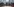 Auf dem Bild sind Container abgebildet, im Hintergrund Hochhäuser.