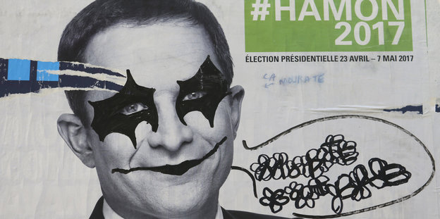 Wahlplakat, mit Grafitti bemalt