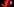 Eine rote, angeschnittene Acerola-Kirsche in einer Nahaufnahme