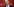 Ein Mann grinst mit geschlossenen Augen etwas merkwürdig