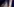 Verblasst und verquollen ist Marine Le Pens Gesicht hinter neben einer französischen Flagge zu sehen