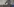 Eine Person im Profil mit ausgestrecktem Arm und Pistole