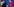 Emmanuel Macron und Angela Merkel stehen vor Mikrofonen