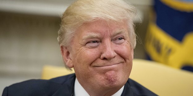 Trump grinst in die Kamera
