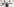 Ein junger Mann steht vor einer Wand voller Disney-Bilder und grinst