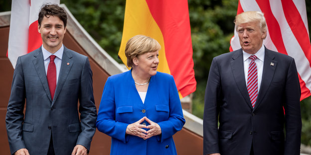 Justin Trudeau, Angela Merkel und Donald Trump posieren beim G7-Gipfel in Taormina in Italien für ein Foto