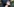 Frau im Nahportrait mit wirbelndem, dunklem Haar