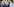 Menschen mit besorgten Gesichtern stehen beisammen