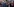Schulz steht lachend am Mikro, mehrere Menschen im Hintergrund applaudieren