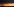 In der Ferne geht die Sonne über einem Kohlekraftwerk auf