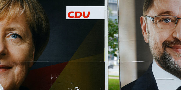 Wahlplakate zeigen Angela Merkel und Martin Schulz