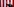 ein Mann mit erhobenem rechten Arm und einem Mikrofon in der Hand, im Hintergrund eine riesige US-Fahne