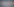 Windrad und Kran im Nebel
