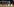 Fußballspieler halten sich an den Händen und gucken Richtung Fanblock