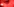 Rote Rauchschwaden und ein Fahnenschwenker in einer Fankurve
