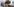 Der Regisseur Dani Levy hat eine schwarze Virtual Reality Brille und Kopfhörer auf