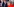 Die deutsche Bundeskanzlerin Angela Merkel wendet sich vom französischen Präsidenten Emmanuel Macron ab, der im Hintergrund lächelt