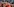 Viele Spieler in roten Hemden umarmen sich