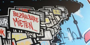 Graffiti an einer Häuserwand mit der Aufschrift "bezahlbare Mieten"